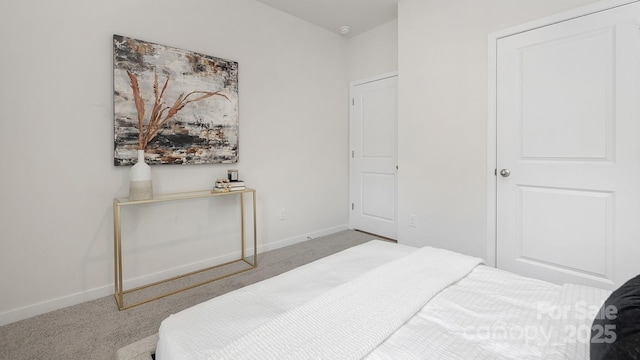 carpeted bedroom with baseboards