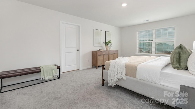 carpeted bedroom with baseboards