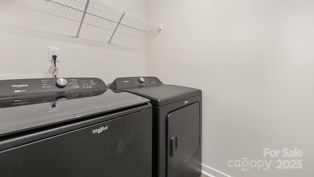 laundry room featuring washer and dryer, laundry area, and baseboards