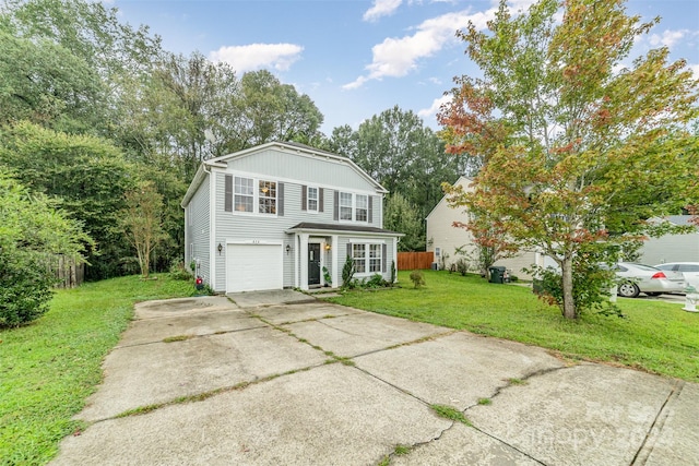 front of property with a front yard and a garage