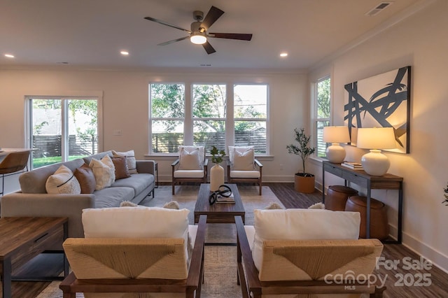 living room featuring hardwood / wood-style flooring, ceiling fan, and ornamental molding