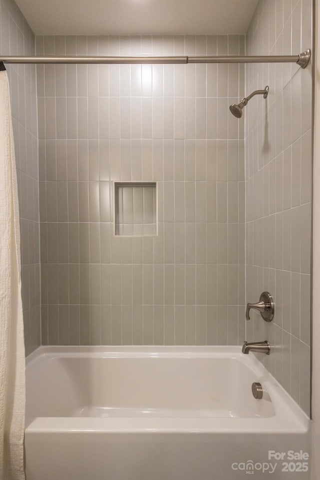 bathroom with shower / bathtub combination with curtain