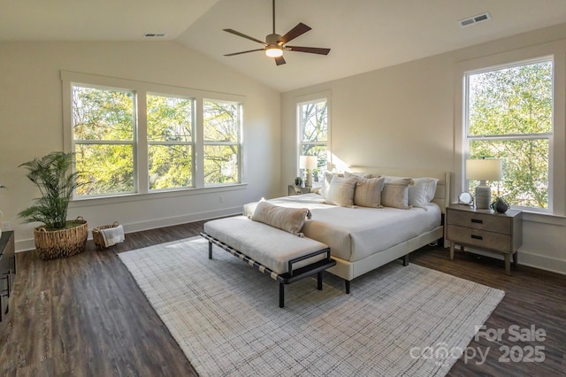 bedroom featuring multiple windows, dark hardwood / wood-style flooring, vaulted ceiling, and ceiling fan