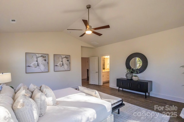 bedroom with ensuite bathroom, vaulted ceiling, ceiling fan, and dark wood-type flooring