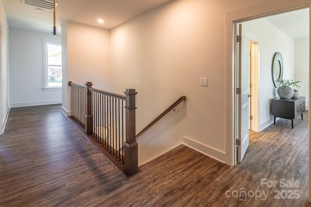 stairs with hardwood / wood-style flooring