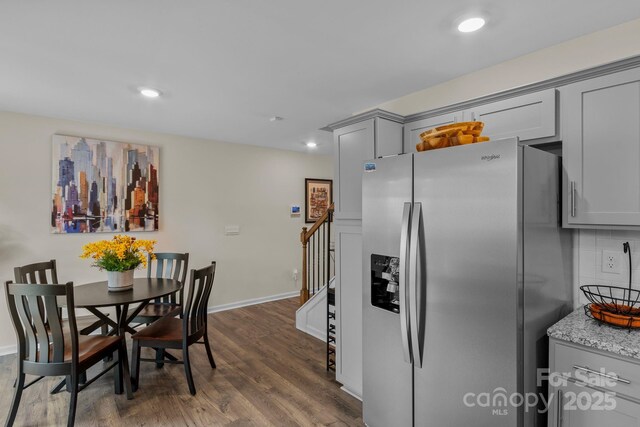 dining area with dark wood-type flooring