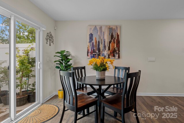 dining space featuring hardwood / wood-style flooring