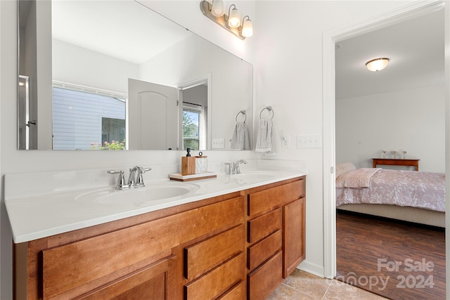 bathroom with vanity and tile patterned floors