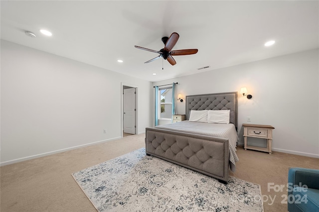 bedroom with ceiling fan and light colored carpet