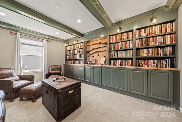 living area featuring built in features, light colored carpet, crown molding, and beamed ceiling