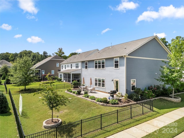 exterior space featuring a patio and a front lawn