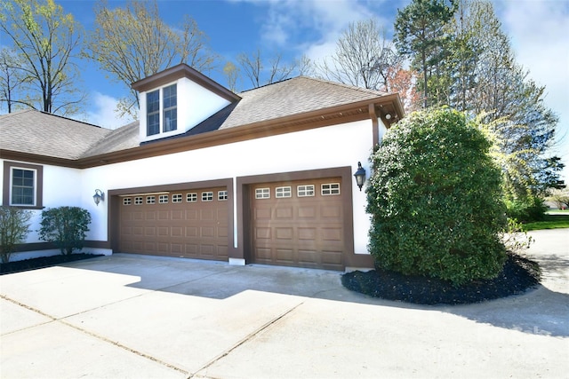 view of side of home featuring a garage