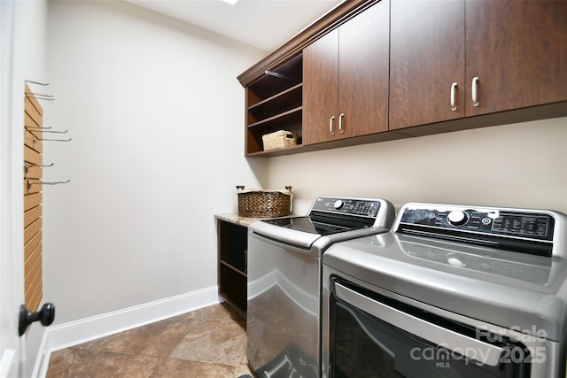 laundry area with cabinets and independent washer and dryer