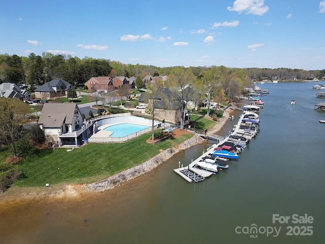 birds eye view of property with a water view