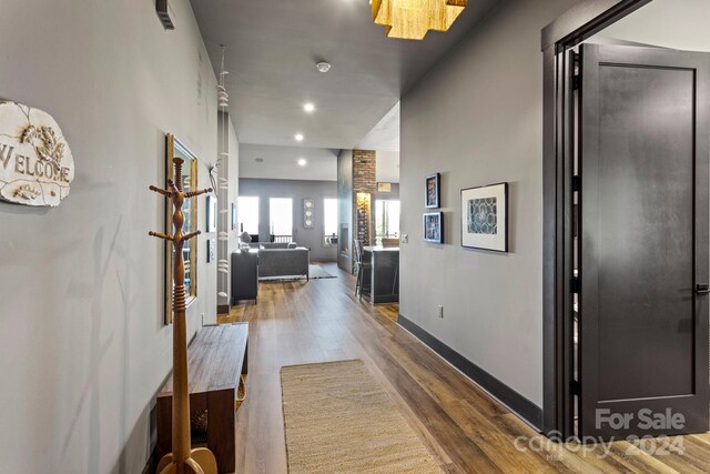 hallway with wood-type flooring