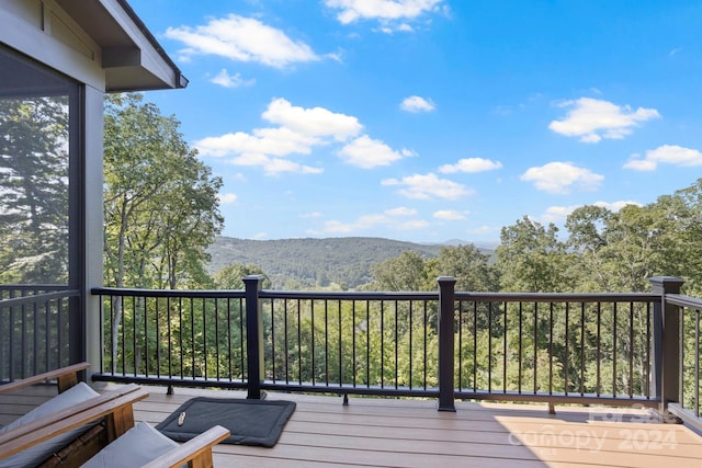 wooden terrace with a mountain view