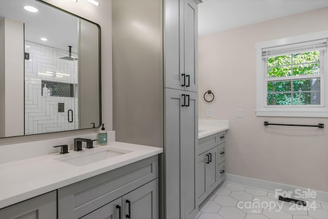 bathroom with vanity, tile patterned flooring, and a shower with door