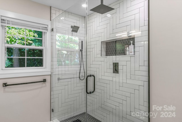 bathroom with an enclosed shower