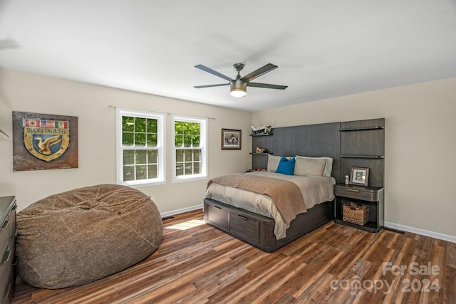 bedroom featuring ceiling fan and dark hardwood / wood-style floors