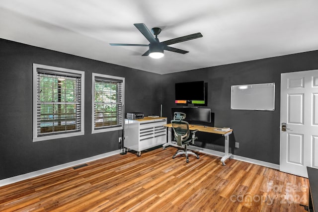 office area with ceiling fan and light hardwood / wood-style floors