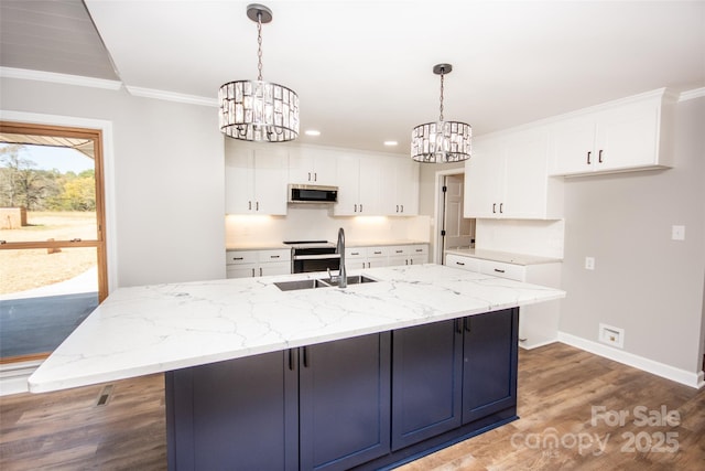 kitchen with sink, a center island with sink, and white cabinets