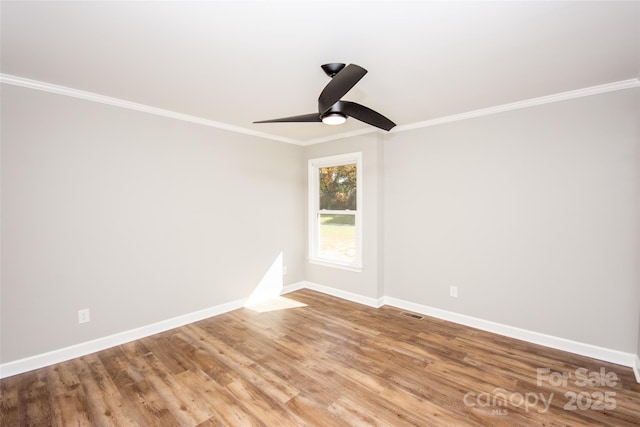 spare room featuring ceiling fan, light hardwood / wood-style flooring, and crown molding