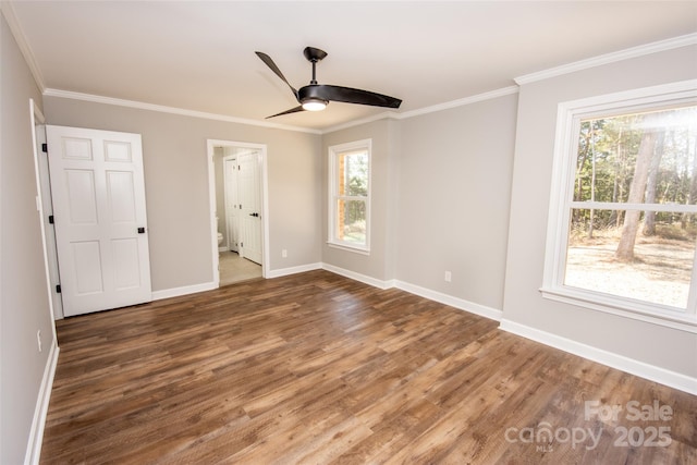 unfurnished bedroom featuring ceiling fan, ornamental molding, dark hardwood / wood-style flooring, and multiple windows