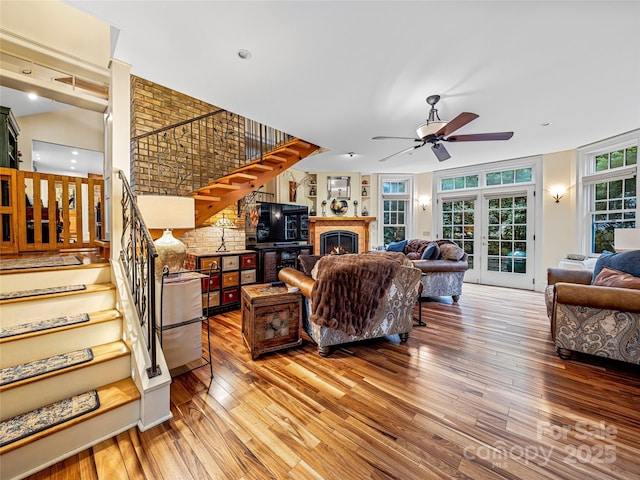 living room with ceiling fan, french doors, and hardwood / wood-style flooring