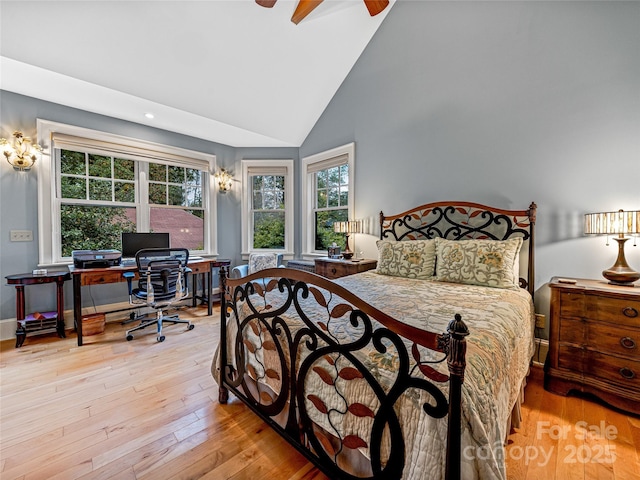 bedroom featuring lofted ceiling, ceiling fan, and light hardwood / wood-style flooring