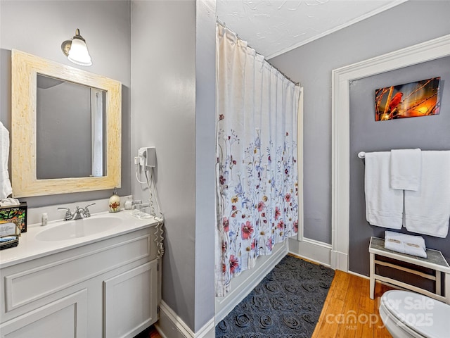 full bathroom with toilet, vanity, shower / bath combo, and hardwood / wood-style floors