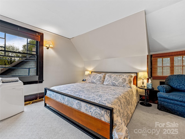 carpeted bedroom featuring lofted ceiling