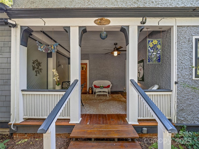 property entrance featuring covered porch and ceiling fan