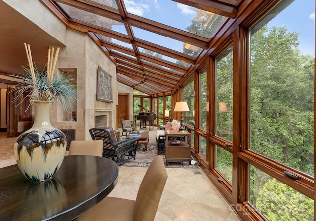 sunroom with plenty of natural light and vaulted ceiling