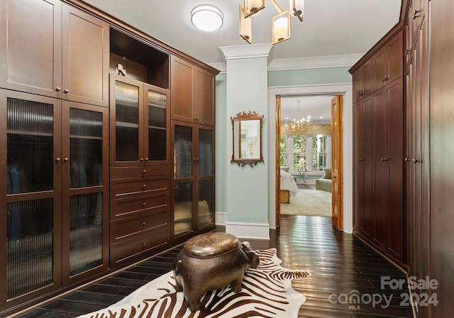 interior space featuring a notable chandelier and dark wood-type flooring