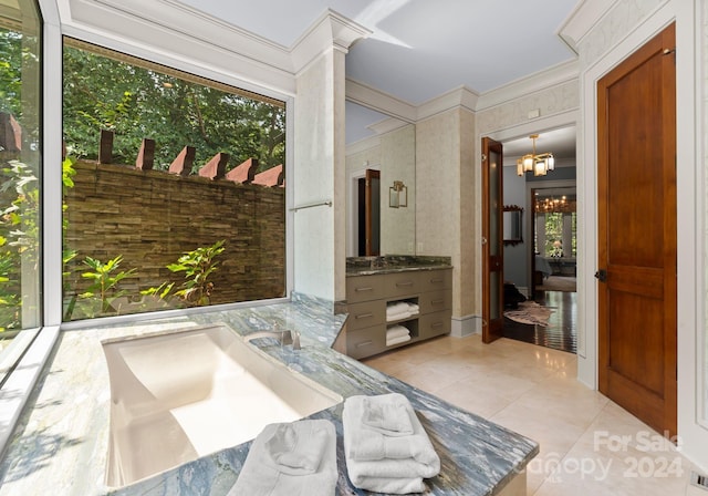 interior space with ornamental molding, a chandelier, and light tile patterned floors