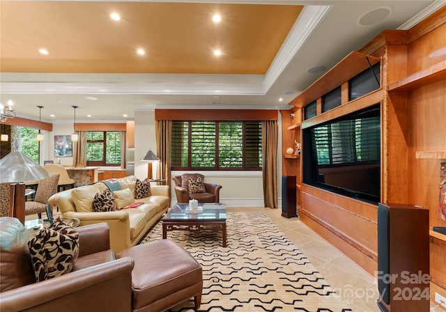 tiled living room with a raised ceiling and crown molding