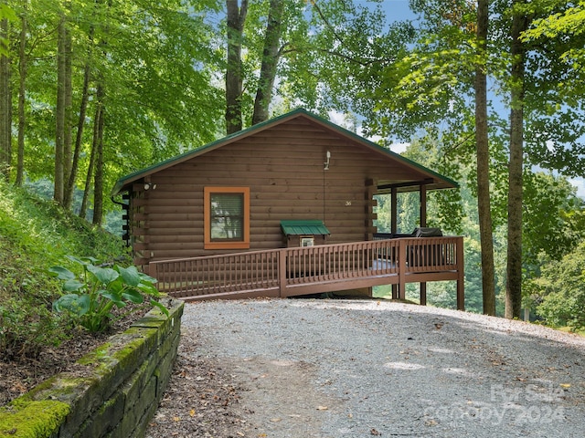 view of home's exterior with a wooden deck