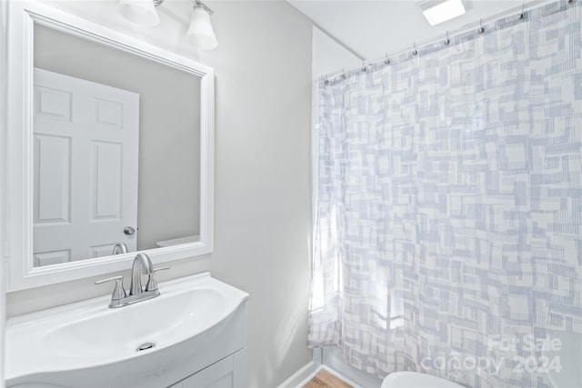 full bath with vanity and a shower with shower curtain