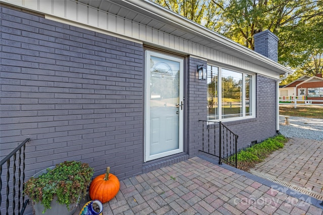 property entrance with a patio area