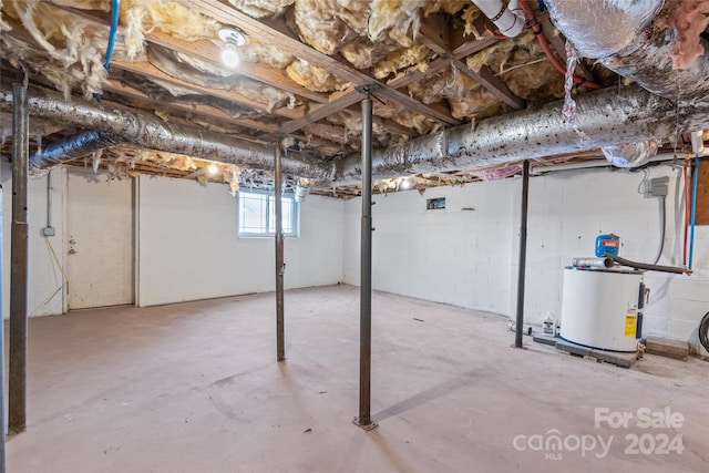 below grade area featuring water heater