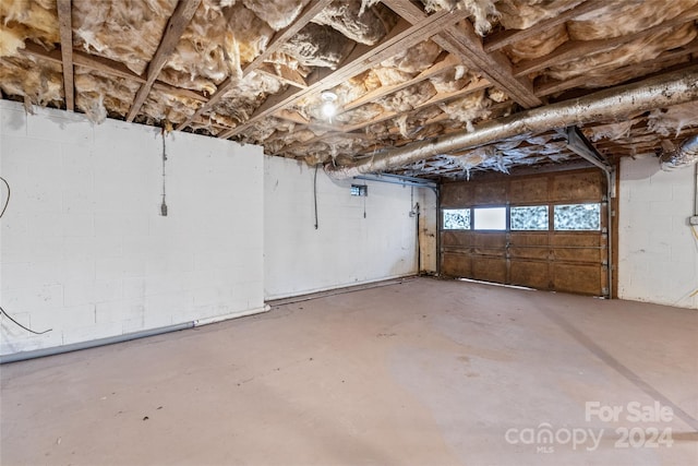unfinished below grade area with concrete block wall