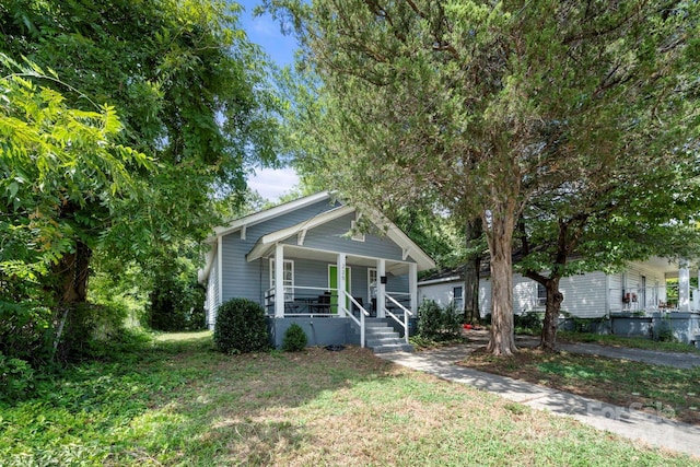 225 Flint St, Charlotte, NC 28216 - bungalow with a front yard and a porch