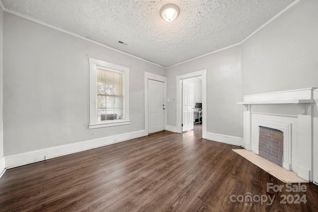 unfurnished living room featuring a textured ceiling and dark hardwood / wood-style flooring