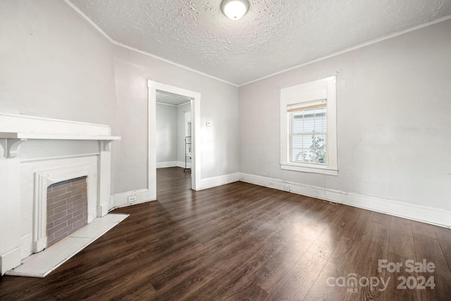 225 Flint St, Charlotte, NC 28216 - unfurnished living room with baseboards, ornamental molding, a fireplace, a textured ceiling, and wood finished floors