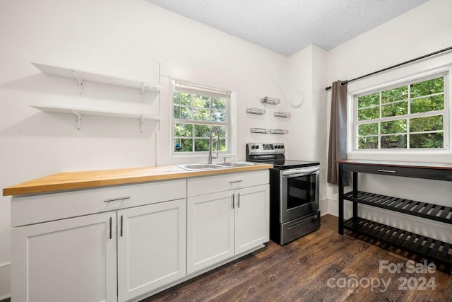 kitchen with a textured ceiling, dark hardwood / wood-style floors, stainless steel electric range, sink, and white cabinetry