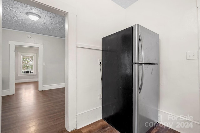 225 Flint St, Charlotte, NC 28216 - kitchen featuring baseboards, freestanding refrigerator, wood finished floors, and a textured ceiling