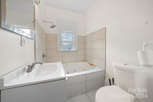 bathroom featuring tile patterned flooring, toilet, and vanity