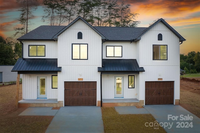 modern farmhouse featuring a garage