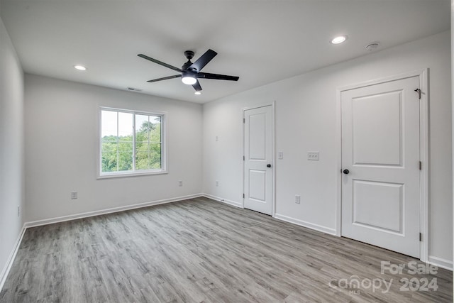 unfurnished bedroom featuring ceiling fan and light wood-type flooring