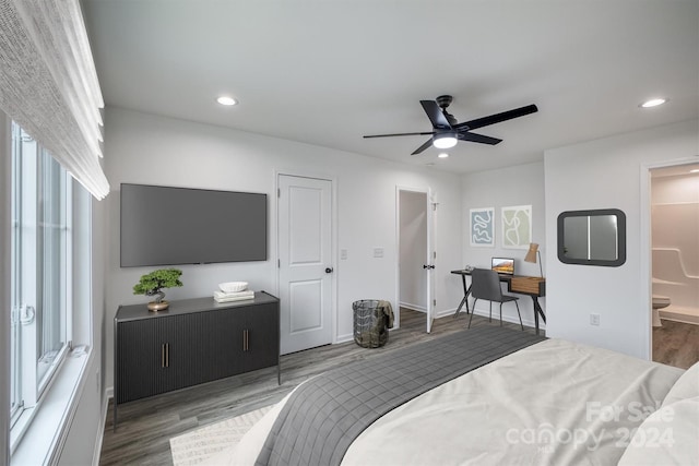 bedroom with connected bathroom, ceiling fan, and hardwood / wood-style flooring